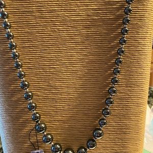 24” graduated genuine stone necklace with safety catch closure.